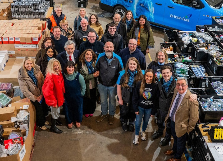 Photo of staff, president, partners and supporters in Lochgelly warehouse